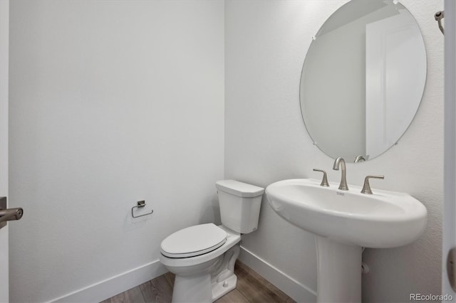 1376 Lumber Ridge Cir N, Erie, CO 80516 - bathroom with baseboards, wood finished floors, and toilet
