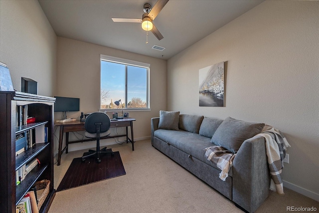 carpeted office with ceiling fan