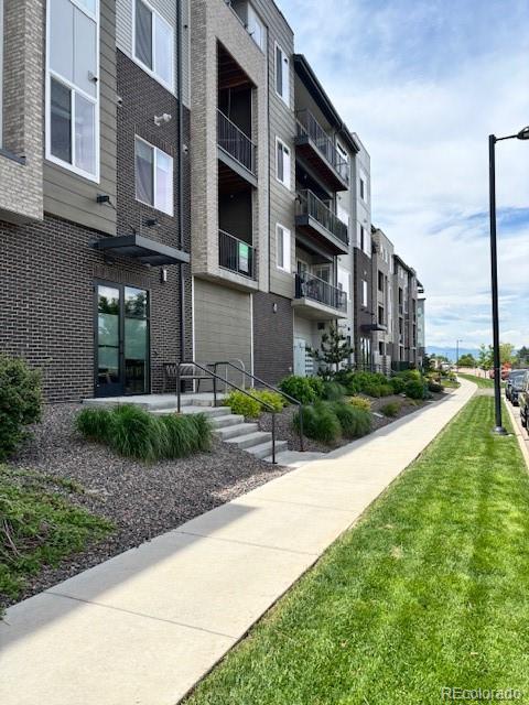 420 E Fremont Pl Unit 203, Centennial, CO 80122 - view of apartment building / complex with a garage