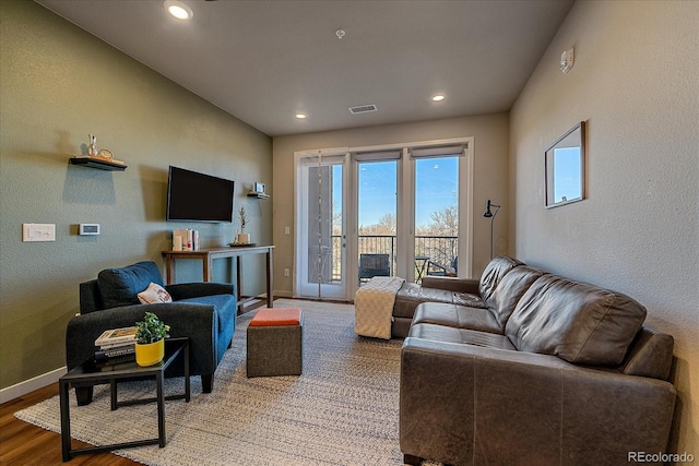 420 E Fremont Pl Unit 203, Centennial, CO 80122 - living area with plenty of natural light, baseboards, recessed lighting, wood finished floors, and a textured wall