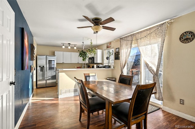 dining area with hardwood / wood-style flooring and ceiling fan