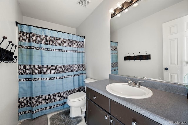 bathroom with toilet, tile patterned floors, a shower with shower curtain, and vanity