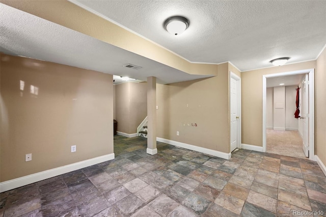 basement featuring a textured ceiling