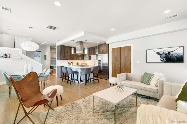 living room with light hardwood / wood-style flooring