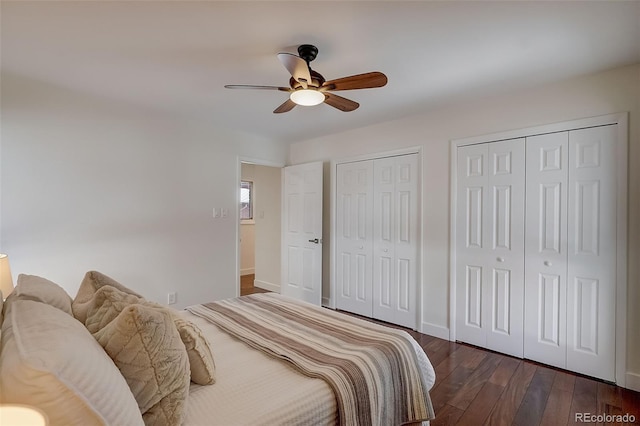 3434 S Race St, Englewood, CO 80113 - bedroom with two closets, dark wood-type flooring, and a ceiling fan