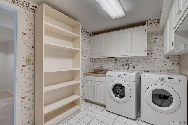3434 S Race St, Englewood, CO 80113 - laundry area featuring cabinet space, washer and dryer, and light tile patterned floors