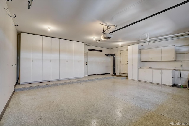 3434 S Race St, Englewood, CO 80113 - garage with a garage door opener and baseboards