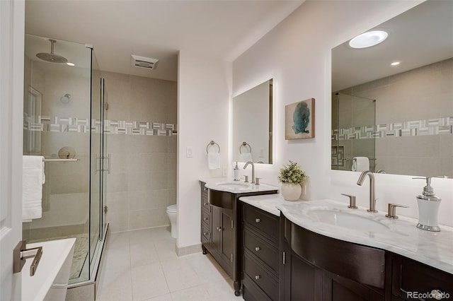 3434 S Race St, Englewood, CO 80113 - bathroom featuring a stall shower, vanity, tile patterned floors, and recessed lighting