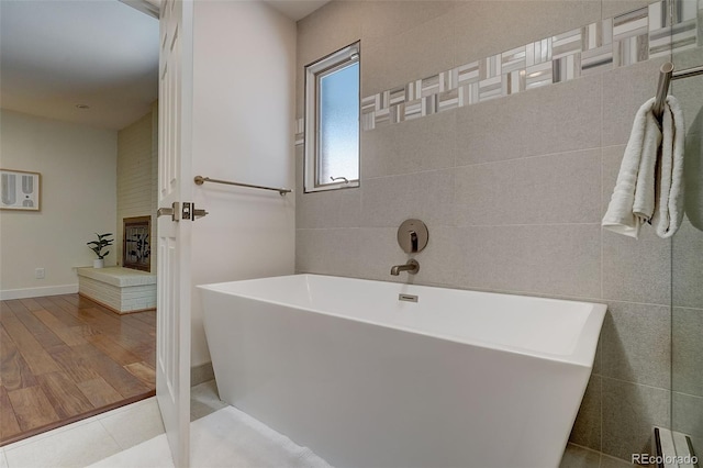 3434 S Race St, Englewood, CO 80113 - full bath with a freestanding tub and baseboards