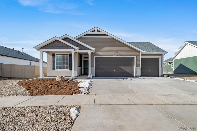22394 E 49th Pl, Aurora, CO 80019 - view of front of house featuring an attached garage and concrete driveway