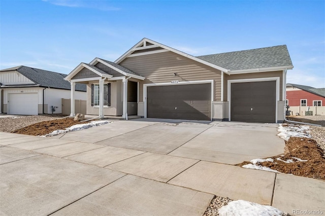 22394 E 49th Pl, Aurora, CO 80019 - ranch-style house with concrete driveway, a garage, covered porch, and a shingled roof