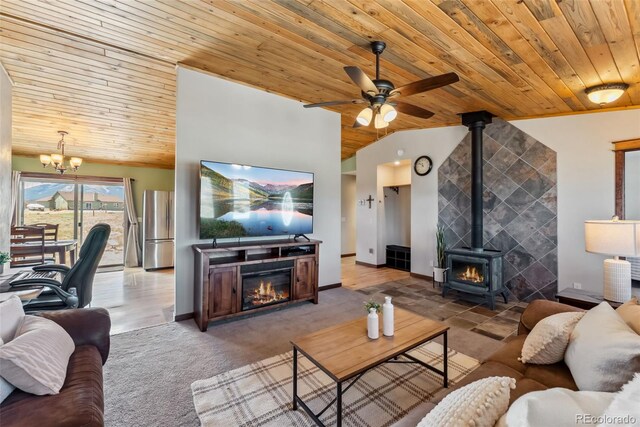 16651 Holly Ct, Buena Vista, CO 81211 - carpeted living area featuring wooden ceiling, ceiling fan, a chandelier, vaulted ceiling, and a fireplace