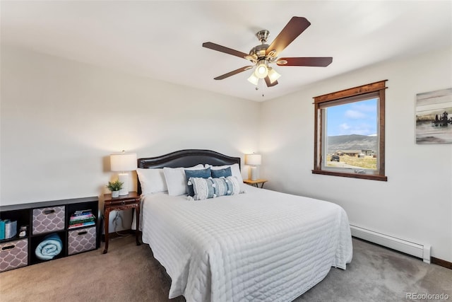 16651 Holly Ct, Buena Vista, CO 81211 - bedroom featuring baseboard heating, carpet floors, ceiling fan, and baseboards