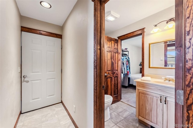 16651 Holly Ct, Buena Vista, CO 81211 - bathroom with vanity, baseboards, and toilet