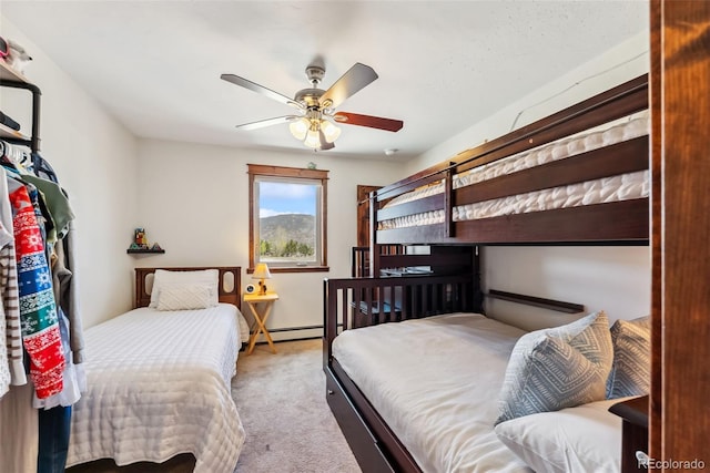 16651 Holly Ct, Buena Vista, CO 81211 - bedroom with a baseboard radiator, carpet flooring, and ceiling fan