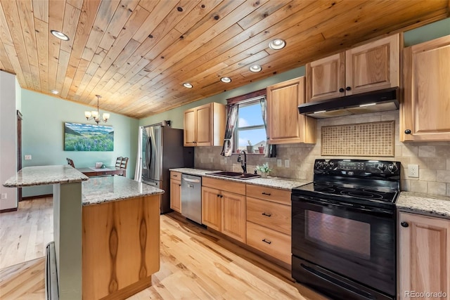 16651 Holly Ct, Buena Vista, CO 81211 - kitchen with stainless steel appliances, under cabinet range hood, light brown cabinets, a chandelier, and recessed lighting