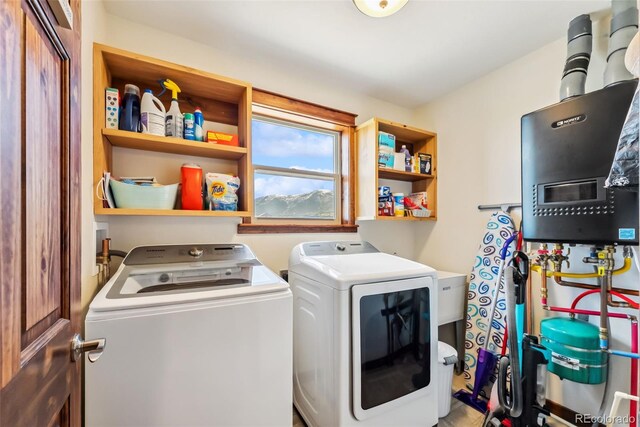 16651 Holly Ct, Buena Vista, CO 81211 - laundry room with separate washer and dryer and water heater