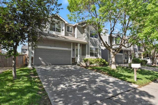 9690 Lansing Cir, Commerce City, CO 80022 - traditional-style house featuring an attached garage and concrete driveway