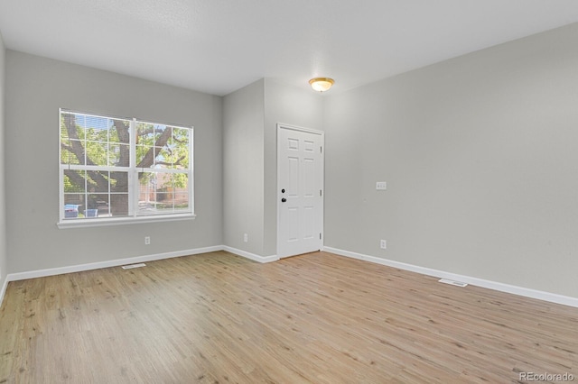 9690 Lansing Cir, Commerce City, CO 80022 - spare room featuring light wood-style floors and baseboards