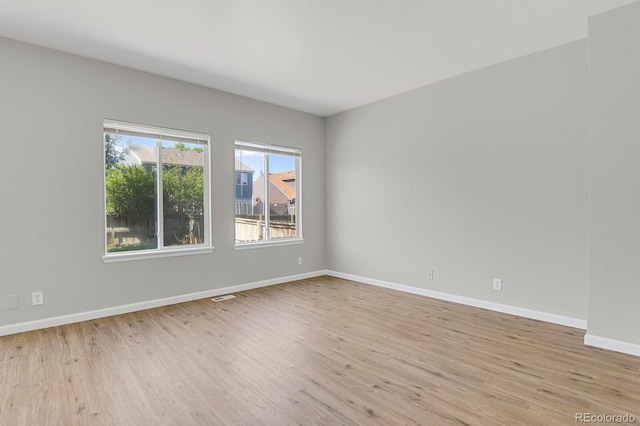 9690 Lansing Cir, Commerce City, CO 80022 - unfurnished room with light wood-style floors and baseboards