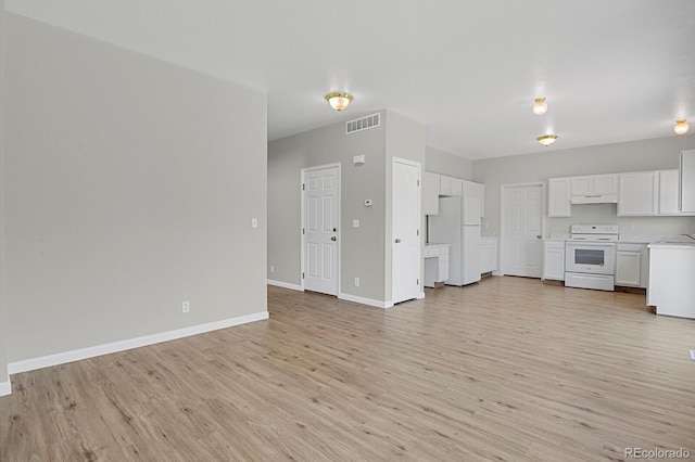 9690 Lansing Cir, Commerce City, CO 80022 - unfurnished living room with light wood-style floors and baseboards