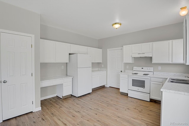 9690 Lansing Cir, Commerce City, CO 80022 - kitchen featuring white appliances, under cabinet range hood, light wood-style floors, and white cabinetry
