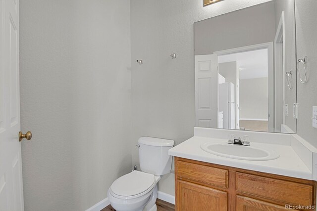 9690 Lansing Cir, Commerce City, CO 80022 - half bath featuring toilet and vanity