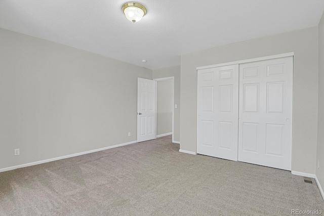 9690 Lansing Cir, Commerce City, CO 80022 - unfurnished bedroom featuring carpet, baseboards, and a closet