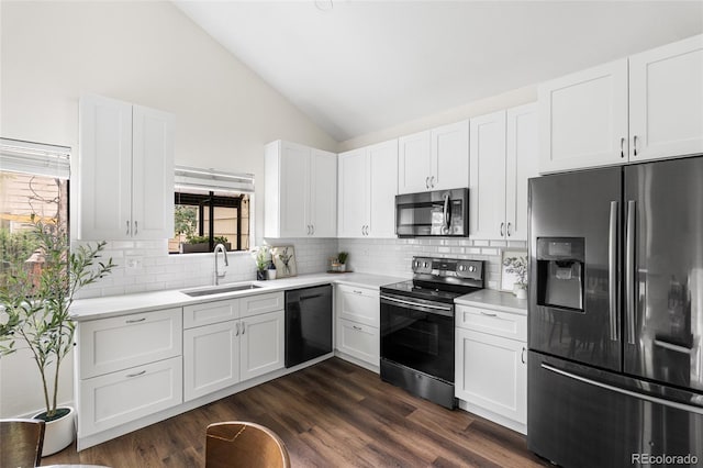 5991 W 68th Ave, Arvada, CO 80003 - kitchen featuring stainless steel appliances, lofted ceiling, a sink, backsplash, and light countertops