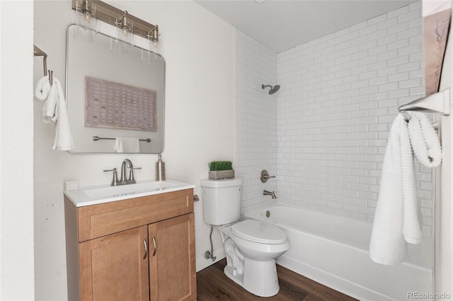 5991 W 68th Ave, Arvada, CO 80003 - bathroom with toilet, vanity, wood finished floors, and washtub / shower combination