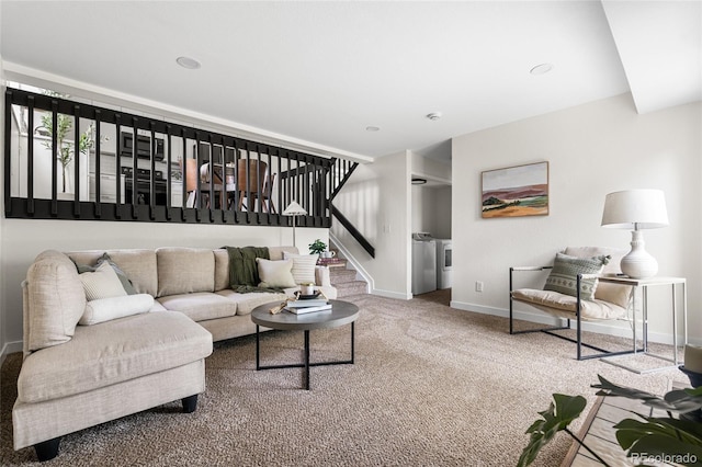 5991 W 68th Ave, Arvada, CO 80003 - living room featuring washer and clothes dryer, stairs, baseboards, and carpet floors