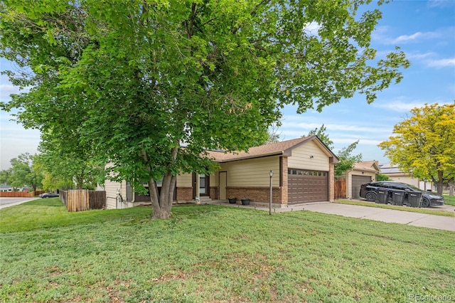 5991 W 68th Ave, Arvada, CO 80003 - view of front facade with brick siding, driveway, and an attached garage