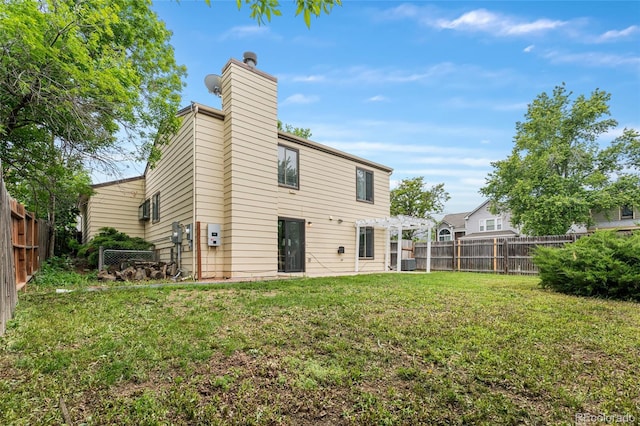 5991 W 68th Ave, Arvada, CO 80003 - rear view of property with a pergola and a chimney