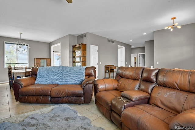 living room featuring a chandelier and light tile patterned floors