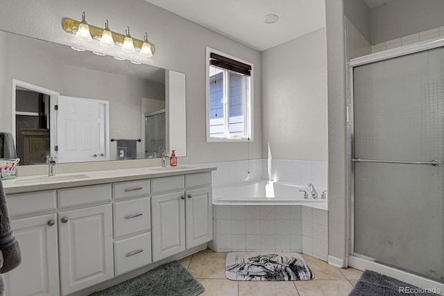 bathroom with tile patterned floors, vanity, and independent shower and bath