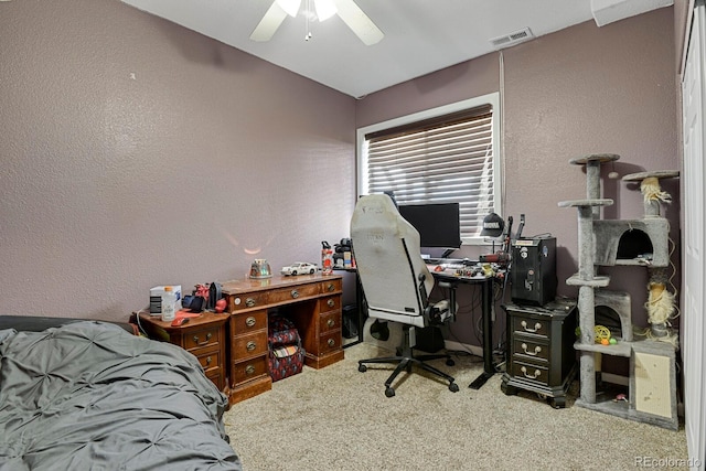 home office with light carpet and ceiling fan