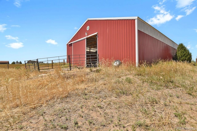 view of outbuilding featuring a rural view