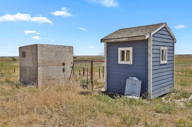 view of outbuilding featuring a rural view