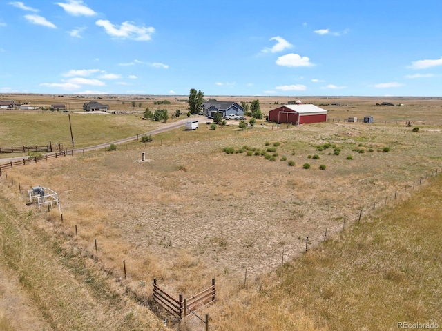 birds eye view of property featuring a rural view