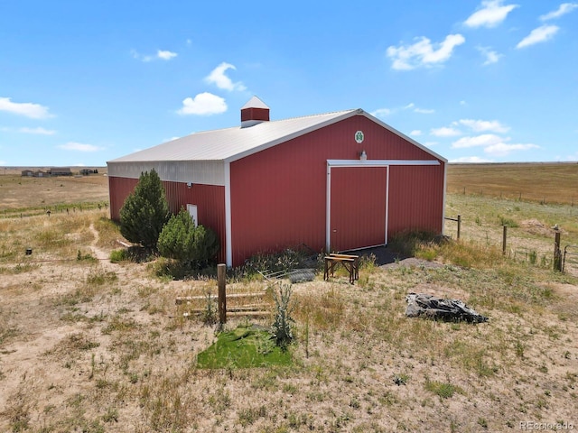 view of outdoor structure featuring a rural view