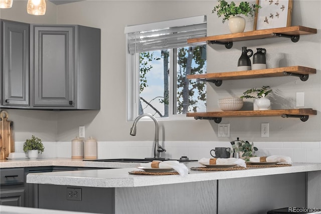 kitchen featuring gray cabinets and sink