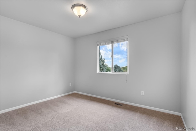 view of carpeted spare room