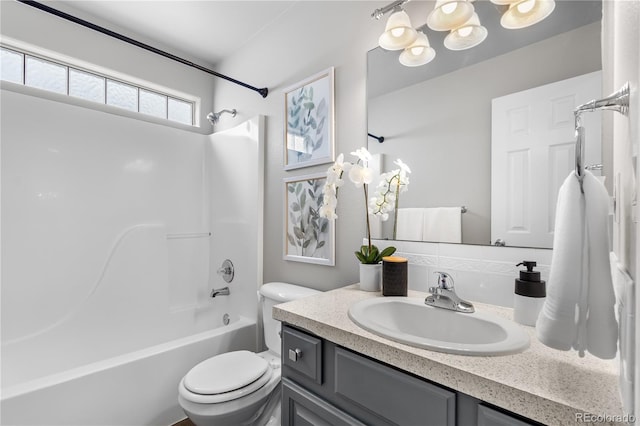 full bathroom with vanity, shower / bathtub combination, and toilet