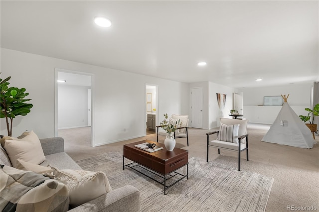 living room featuring light colored carpet