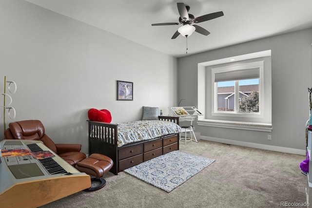 bedroom featuring ceiling fan and light carpet