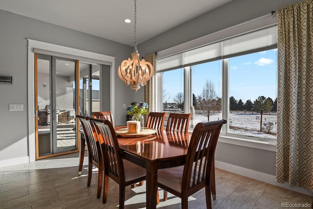 dining area featuring an inviting chandelier