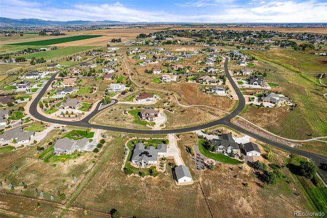 birds eye view of property featuring a mountain view