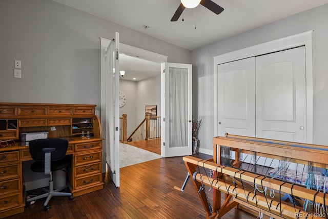 home office with ceiling fan, dark wood-type flooring, and french doors