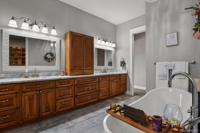 bathroom featuring vanity and a tub to relax in