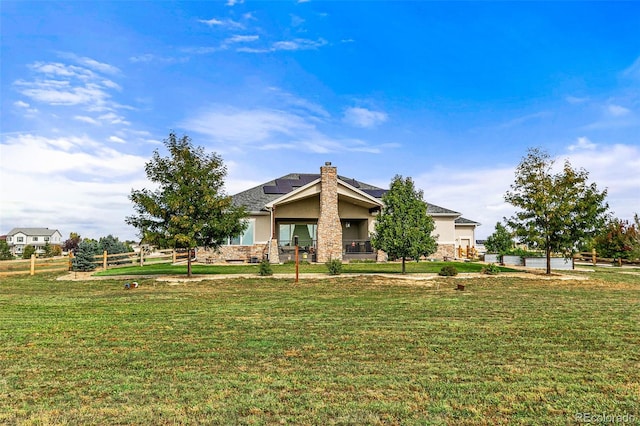 17155 Primrose Ln, Mead, CO 80542 - view of front of house with solar panels, stucco siding, stone siding, and a chimney